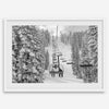 A fine art black and white mountain ski print showing a ski lift winding up the mountain with a stunning winter snow forest around it.