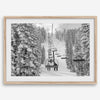 A fine art black and white mountain ski print showing a ski lift winding up the mountain with a stunning winter snow forest around it.
