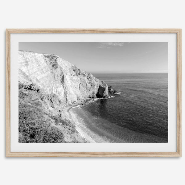 A black and white fine art ocean wall art print of a coastal cliff and beautiful beach in Chimney Rock trail, Point Reyes, California.