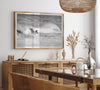 A black and white fine art surf print featuring a lone surfer riding the waves in Pismo Beach, California.