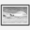 A black and white fine art surf print featuring a lone surfer riding the waves in Pismo Beach, California.