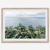Tropical ocean view with lush green foliage overlooking the Pacific from Kauai, captured in fine art photography.