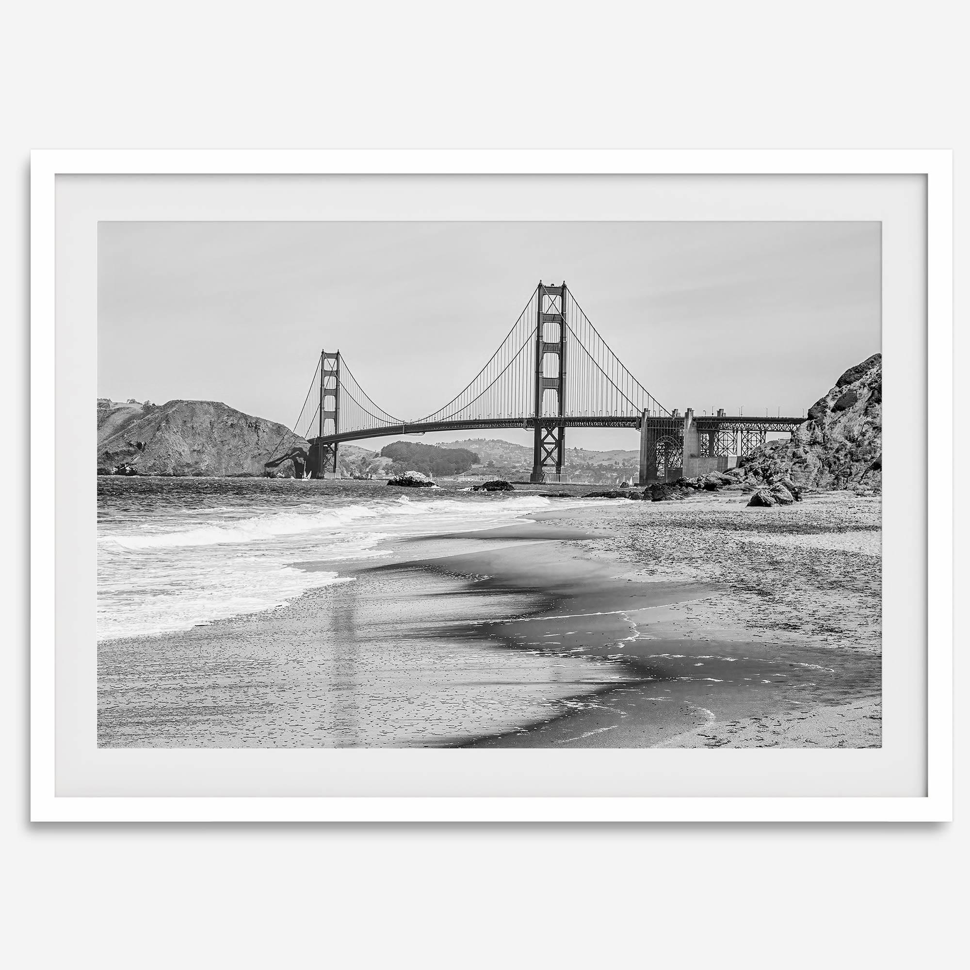 Fine art black and white print of Golden Gate Bridge from Baker Beach, San Francisco. Bridge with reflection in beach surf. Framed or unframed option available