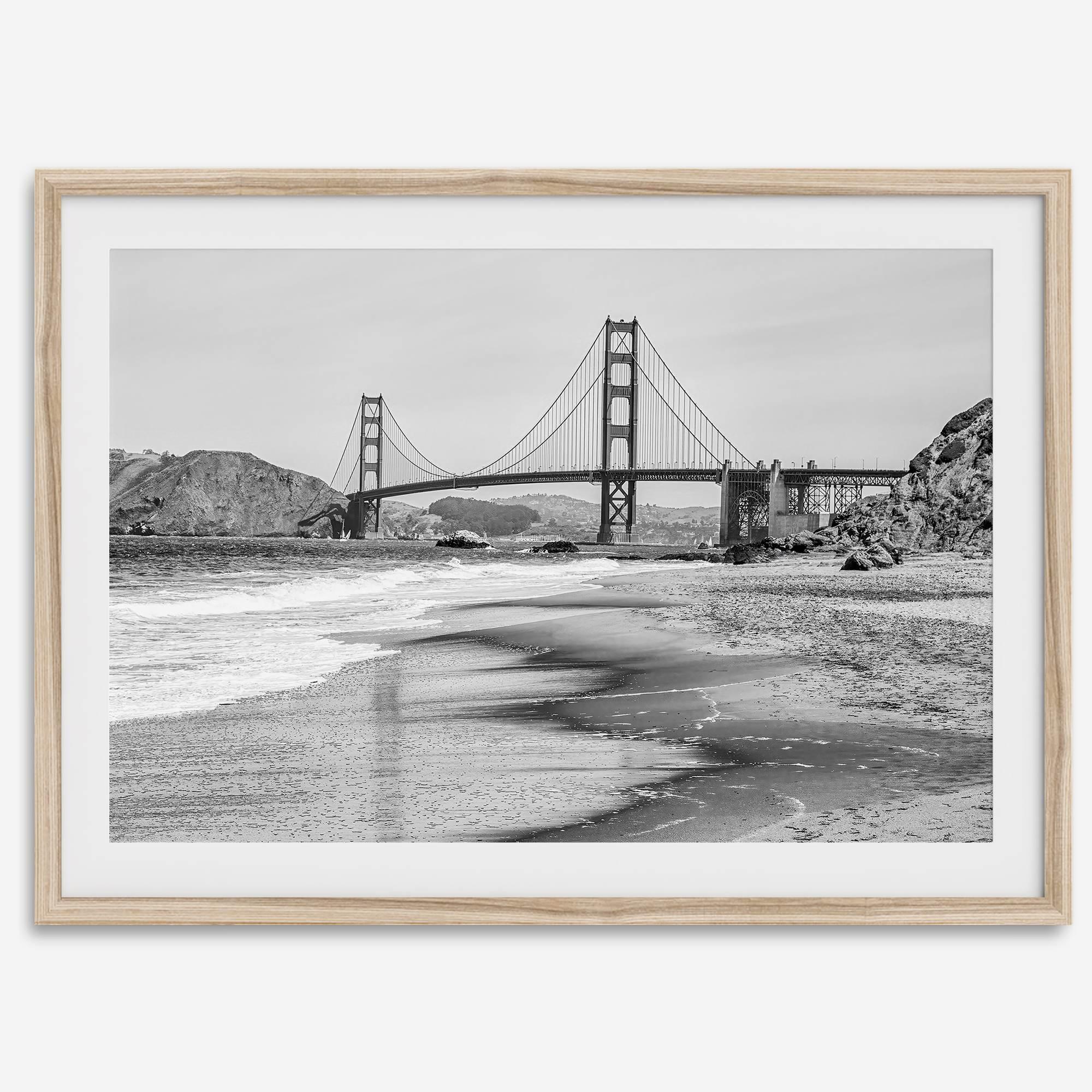 Fine art black and white print of Golden Gate Bridge from Baker Beach, San Francisco. Bridge with reflection in beach surf. Framed or unframed option available