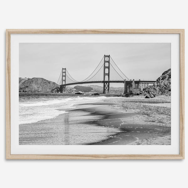 Fine art black and white print of Golden Gate Bridge from Baker Beach, San Francisco. Bridge with reflection in beach surf. Framed or unframed option available