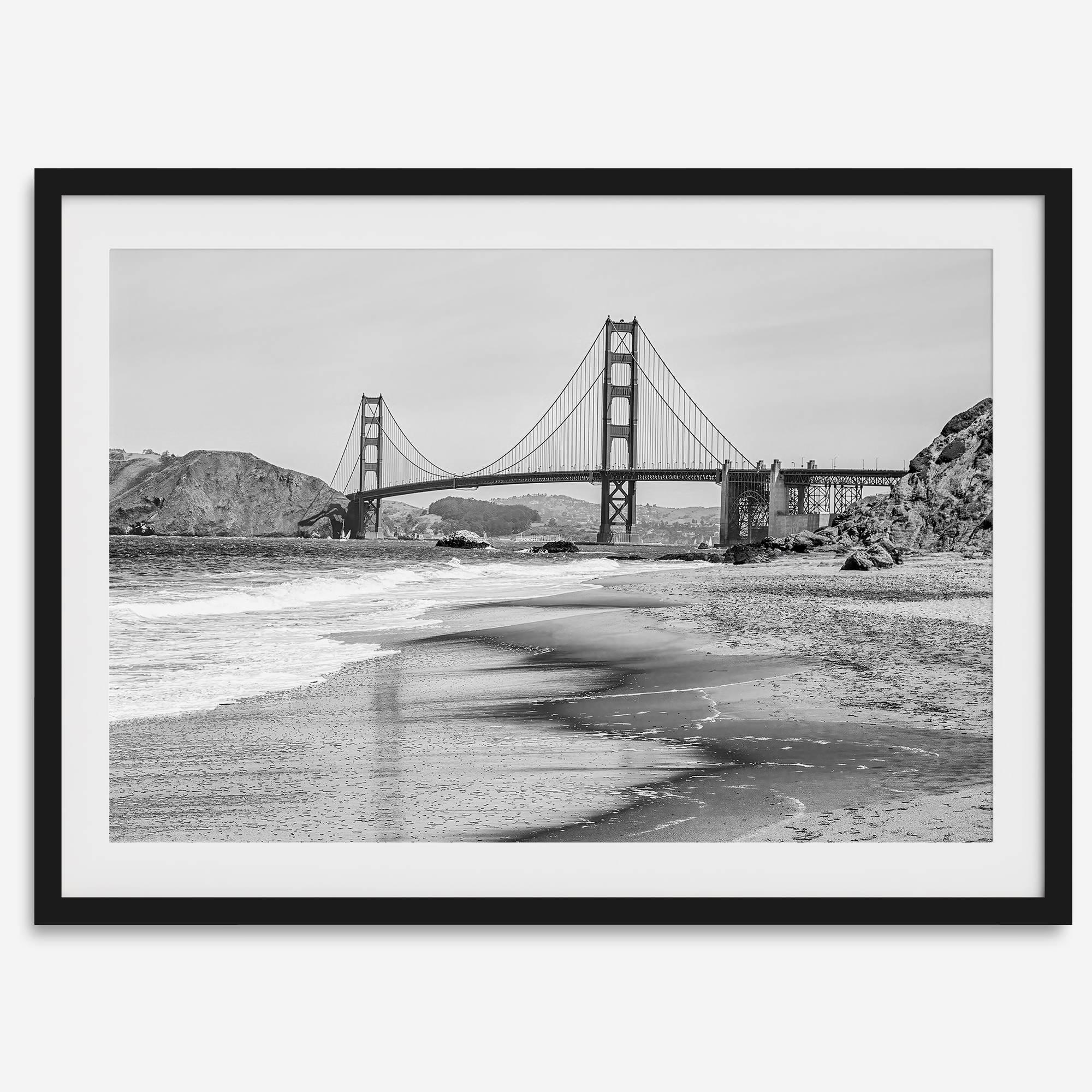 Fine art black and white print of Golden Gate Bridge from Baker Beach, San Francisco. Bridge with reflection in beach surf. Framed or unframed option available