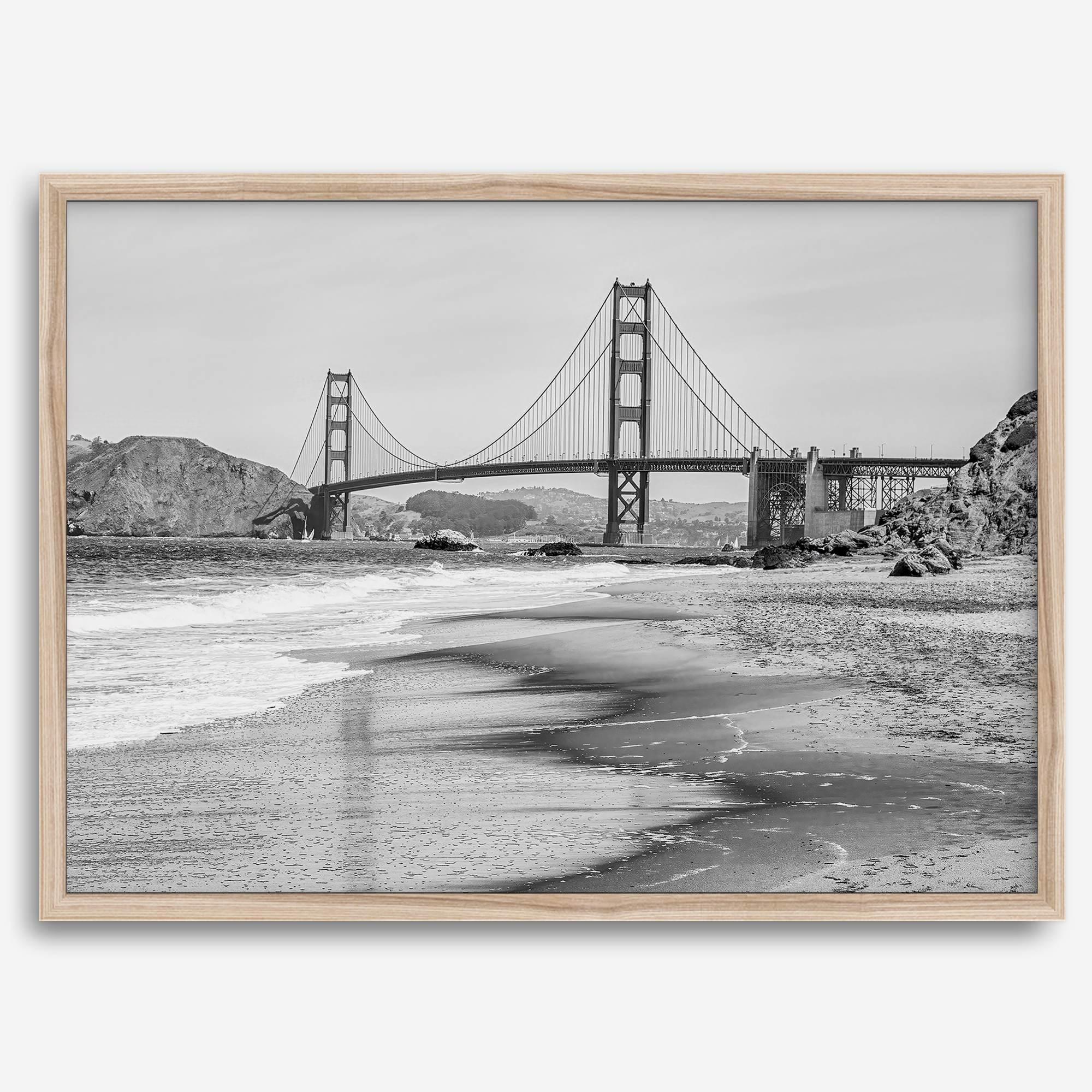 Fine art black and white print of Golden Gate Bridge from Baker Beach, San Francisco. Bridge with reflection in beach surf. Framed or unframed option available