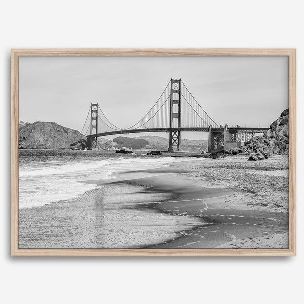 Fine art black and white print of Golden Gate Bridge from Baker Beach, San Francisco. Bridge with reflection in beach surf. Framed or unframed option available