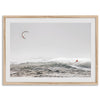 Wind surfer riding waves in Maui with kite above and misty ocean below.