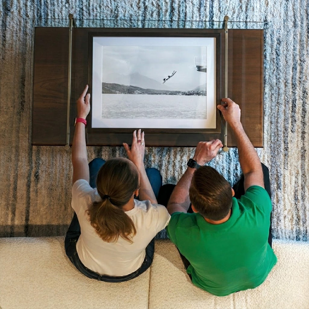 A couple looking at a fine art print from Inframe