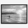 Surfer Wall Art featuring a lone surfer emerging from the ocean at Hanalei Bay in black-and-white photography.