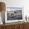 This breathtaking fine art Lake Tahoe print captures the perfect shape of the huge rocks that rise from the crystal-clear water, creating a beautiful contrast against the blue sky and the distant mountain range.