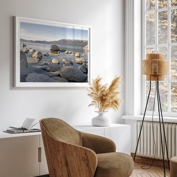 This breathtaking fine art Lake Tahoe print captures the perfect shape of the huge rocks that rise from the crystal-clear water, creating a beautiful contrast against the blue sky and the distant mountain range.