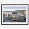 This breathtaking fine art Lake Tahoe print captures the perfect shape of the huge rocks that rise from the crystal-clear water, creating a beautiful contrast against the blue sky and the distant mountain range.