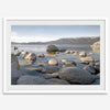 This breathtaking fine art Lake Tahoe print captures the perfect shape of the huge rocks that rise from the crystal-clear water, creating a beautiful contrast against the blue sky and the distant mountain range.