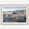 This breathtaking fine art Lake Tahoe print captures the perfect shape of the huge rocks that rise from the crystal-clear water, creating a beautiful contrast against the blue sky and the distant mountain range.
