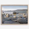 This breathtaking fine art Lake Tahoe print captures the perfect shape of the huge rocks that rise from the crystal-clear water, creating a beautiful contrast against the blue sky and the distant mountain range.