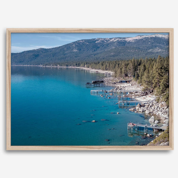 Captivating fine art print of Lake Tahoe showcasing docks, boats, beachfront, lush forest, majestic mountain, and serene waters, capturing the essence of lake life in Incline Village, Nevada.