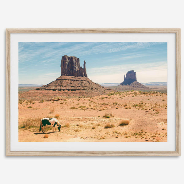 A framed or unframed fine art photography desert print of a horse in Monument Valley, Utah. This wall art features unique rock formations native to the Monument Valley area. This horse wall art comes in different sizes, including extra large.