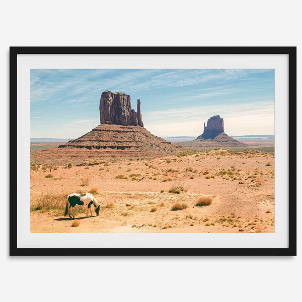 A framed or unframed fine art photography desert print of a horse in Monument Valley, Utah. This wall art features unique rock formations native to the Monument Valley area. This horse wall art comes in different sizes, including extra large.