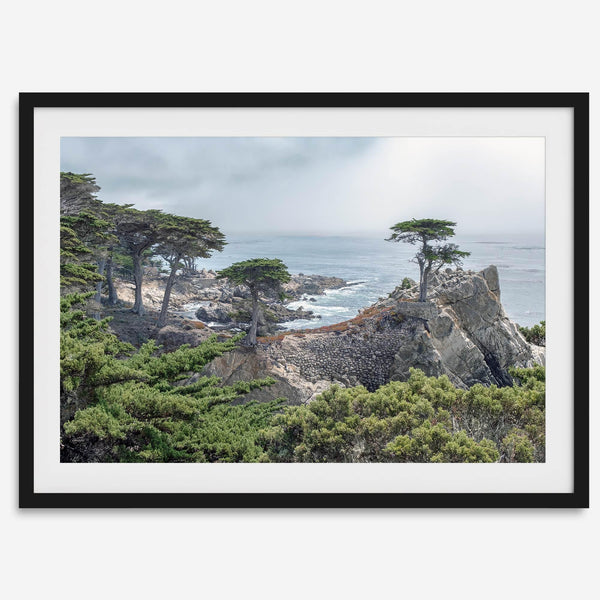 A fine art coastal print showcasing a lone cypress overlooking the ocean in 17 miles drive near Monterey, California. This ocean wall art is available framed or unframed.