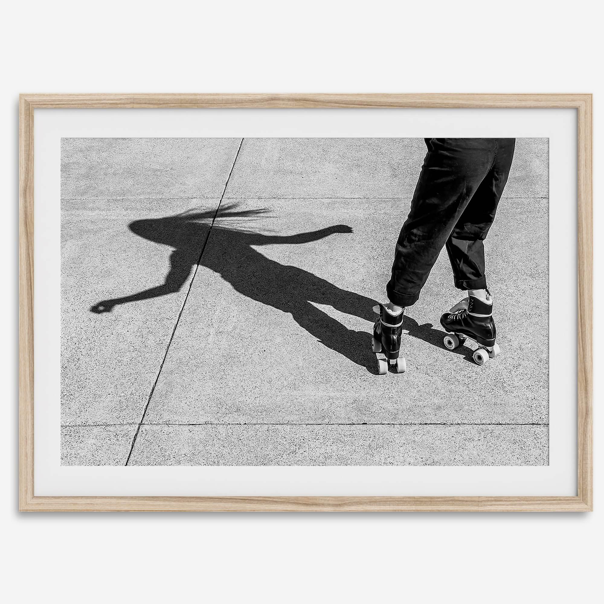Black and white rollerskate photography taken in San Francisco during Fleet Week, showing a skater’s shadow on concrete, capturing minimalist urban style.