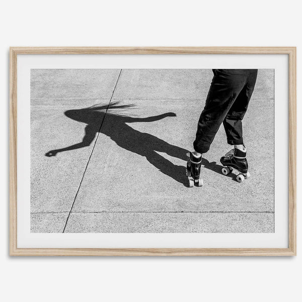 Black and white rollerskate photography taken in San Francisco during Fleet Week, showing a skater’s shadow on concrete, capturing minimalist urban style.