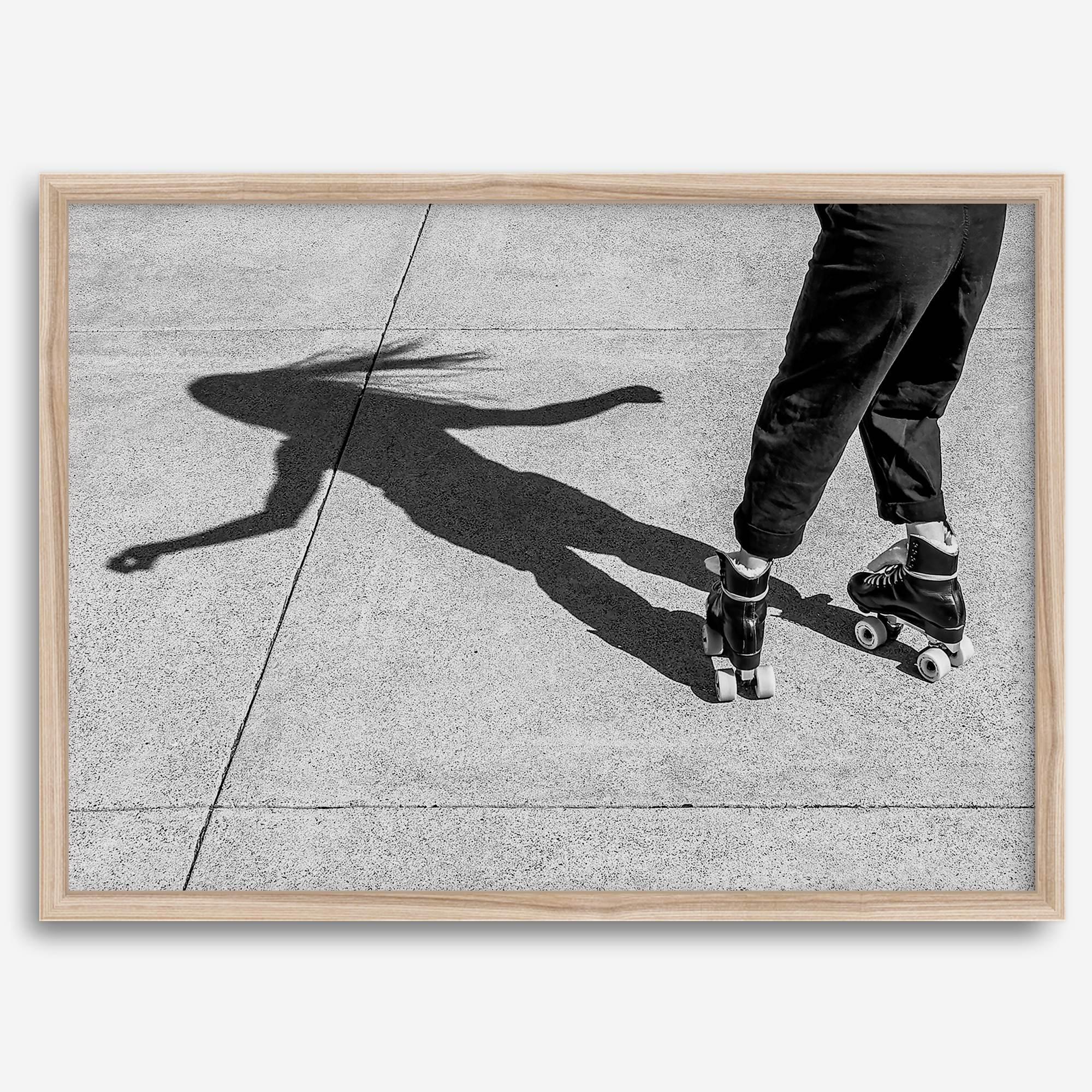 Black and white rollerskate photography taken in San Francisco during Fleet Week, showing a skater’s shadow on concrete, capturing minimalist urban style.