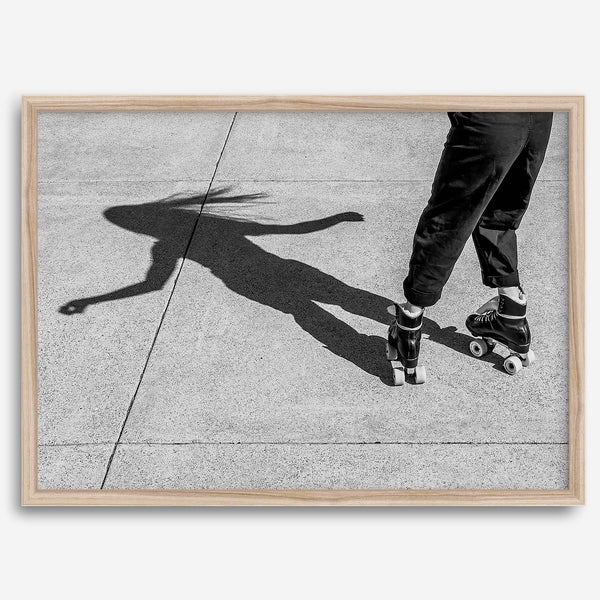 Black and white rollerskate photography taken in San Francisco during Fleet Week, showing a skater’s shadow on concrete, capturing minimalist urban style.
