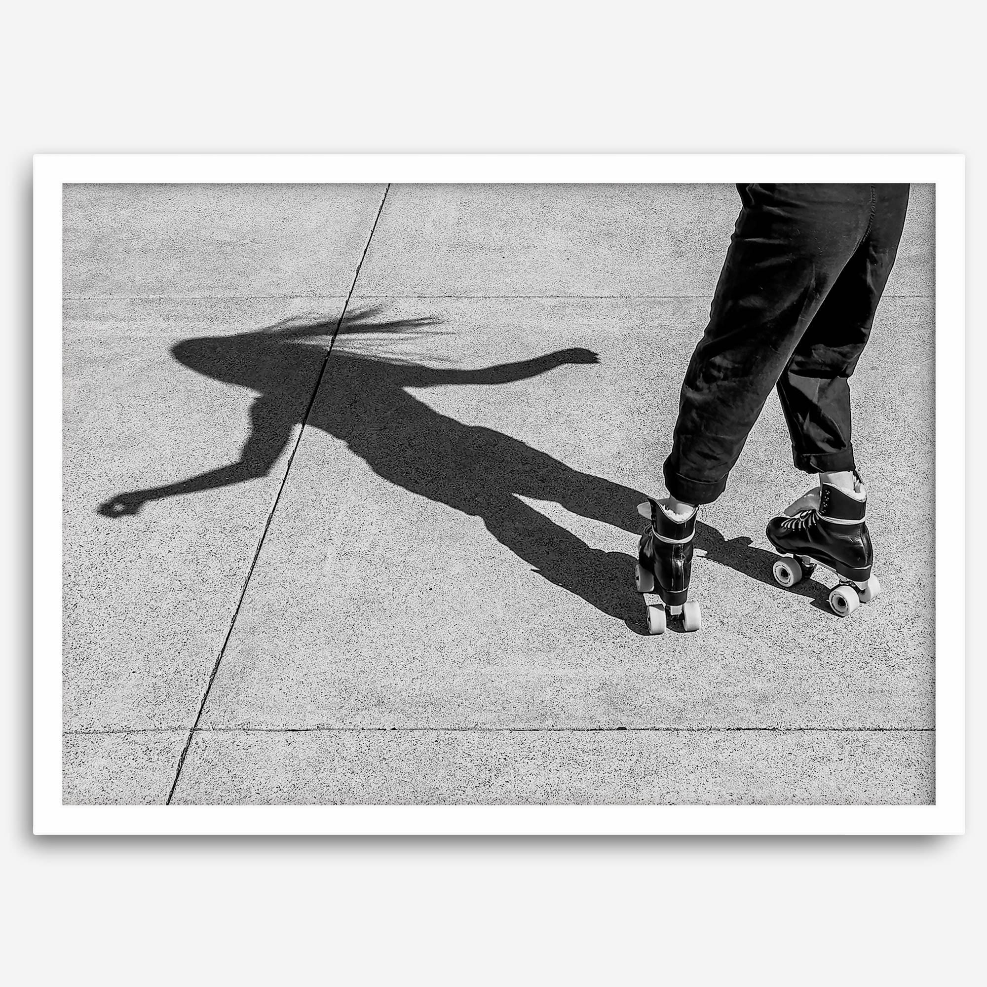 Black and white rollerskate photography taken in San Francisco during Fleet Week, showing a skater’s shadow on concrete, capturing minimalist urban style.