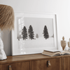 Snowy winter scene artwork with tall pine trees in a peaceful snow-covered field, perfect for minimalist wall decor.