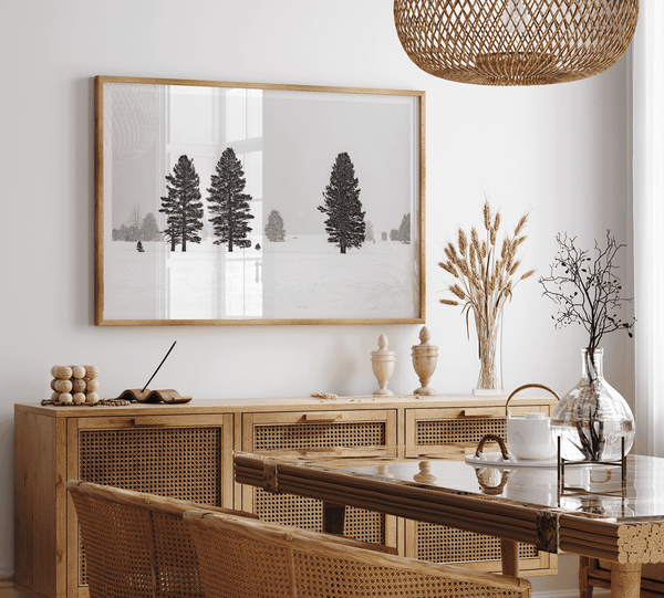 Snowy winter scene artwork with tall pine trees in a peaceful snow-covered field, perfect for minimalist wall decor.
