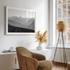 Black and white mountain photography wall art showcasing multiple layers of snowy mountain ranges. 