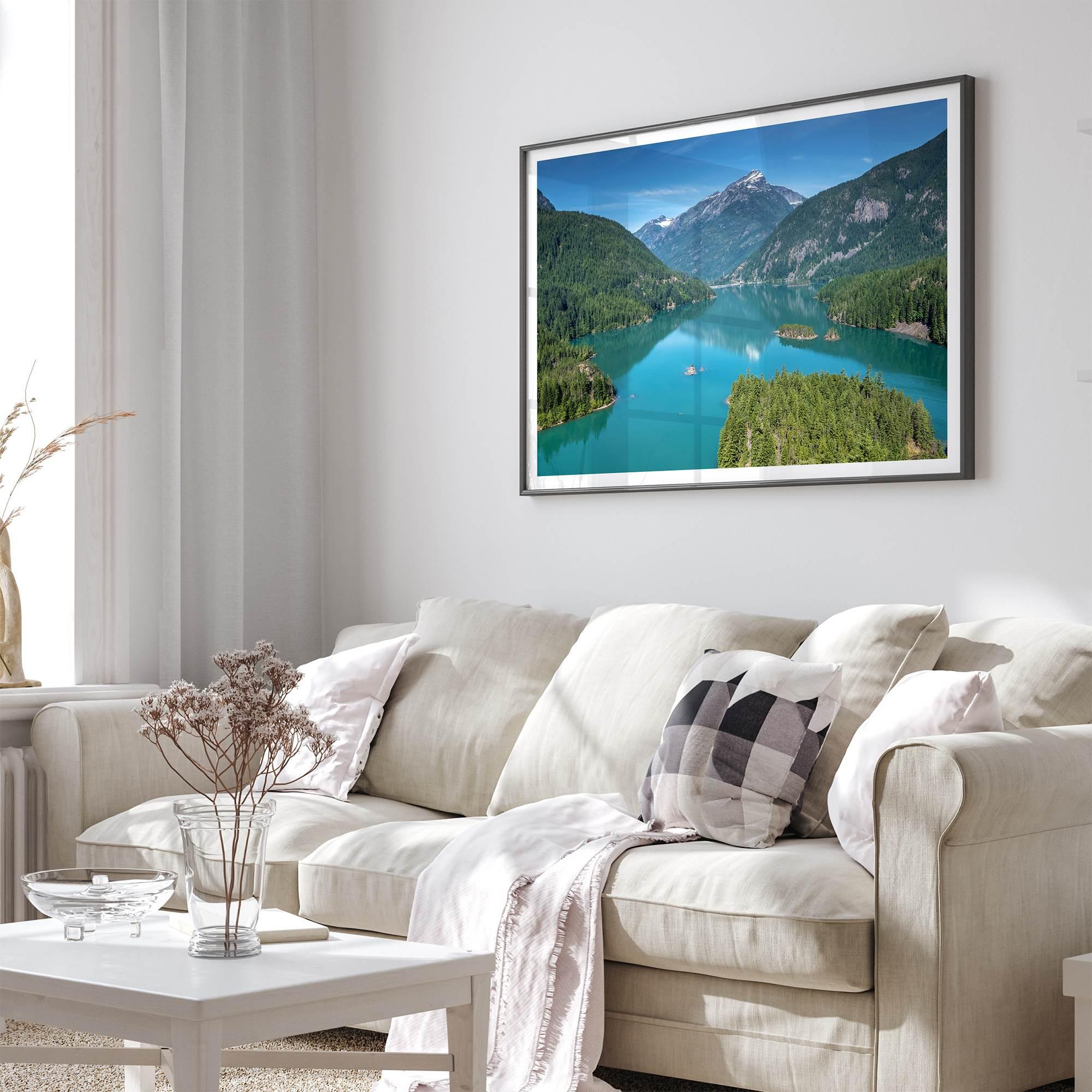 A fine art poster print of Diablo Lake in North Cascades National Park showcasing the deep blue water and the reflection of the surrounding mountains.