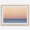 This stunning fine art ocean sunset photography print features a breathtaking scene of a boat against a golden and pink sky at sunset. The warm glow of the sunset and the natural beauty of the ocean and sky combine to create a soothing atmosphere.