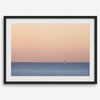 This stunning fine art ocean sunset photography print features a breathtaking scene of a boat against a golden and pink sky at sunset. The warm glow of the sunset and the natural beauty of the ocean and sky combine to create a soothing atmosphere.