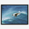 Surfer flying above a turquoise wave in Santa Cruz captured in vibrant ocean photography.