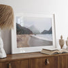 Framed Pfeiffer Beach wall art with foggy Big Sur cliffs and coastal shoreline
