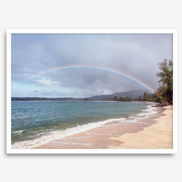 Modern coastal wall art featuring a Kauai beach with a vivid rainbow over turquoise ocean waters and golden sand