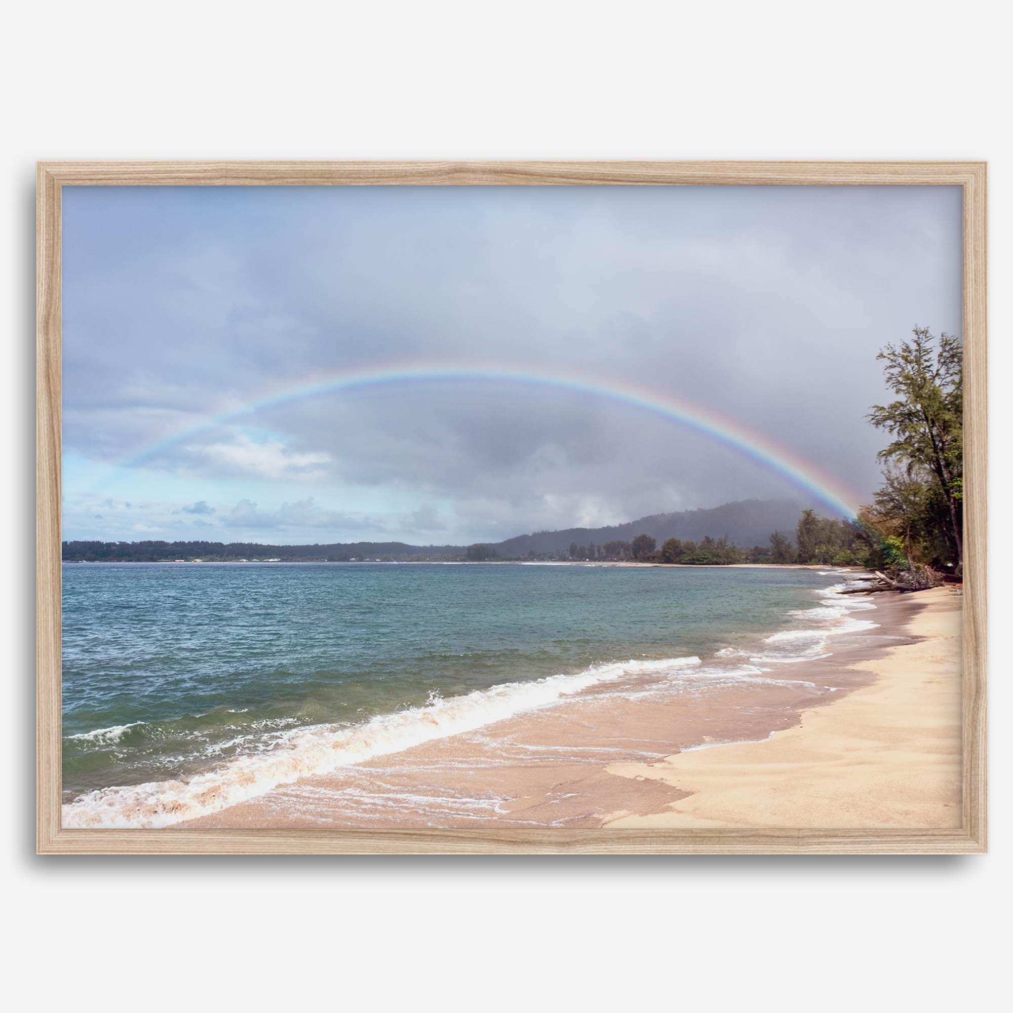 Modern coastal wall art featuring a Kauai beach with a vivid rainbow over turquoise ocean waters and golden sand