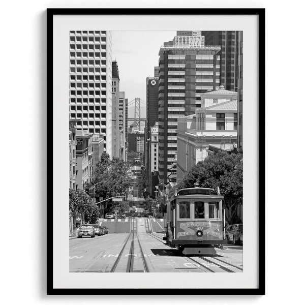 A San Francisco oversized set of 3 framed or unframed wall art. The prints feature a San Francisco cable car overlooking the Bay Bridge, the Golden Gate Bridge from Baker Beach, and the famous Painted Ladies with the San Francisco skyline.