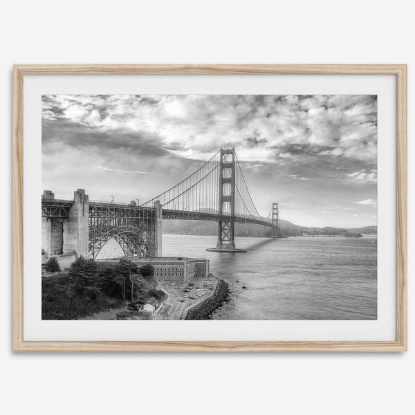 Golden Gate Bridge Wall Art in black-and-white HDR photography with dramatic clouds and water reflections.