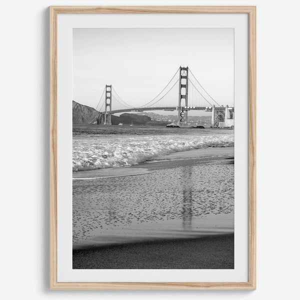 A fine art black and white print of the Golden Gate Bridge in San Francisco. This photo was taken from Baker Beach, showing the beautiful reflection of the bridge in the ocean. It is an excellent addition to your wall decor or a San Francisco gift.