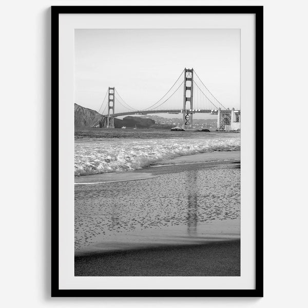 A fine art black and white print of the Golden Gate Bridge in San Francisco. This photo was taken from Baker Beach, showing the beautiful reflection of the bridge in the ocean. It is an excellent addition to your wall decor or a San Francisco gift.