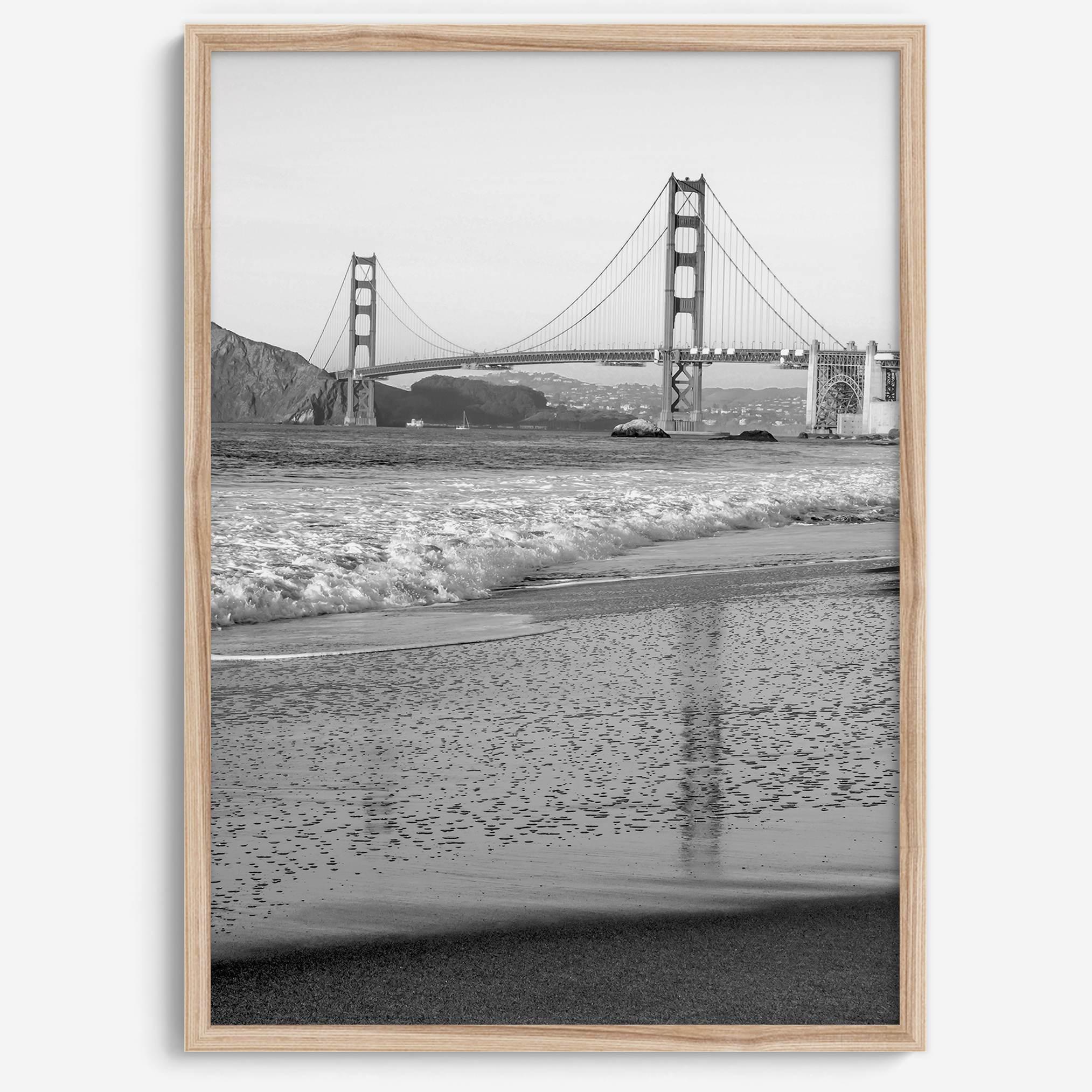A fine art black and white print of the Golden Gate Bridge in San Francisco. This photo was taken from Baker Beach, showing the beautiful reflection of the bridge in the ocean. It is an excellent addition to your wall decor or a San Francisco gift.