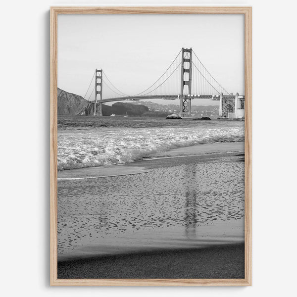 A fine art black and white print of the Golden Gate Bridge in San Francisco. This photo was taken from Baker Beach, showing the beautiful reflection of the bridge in the ocean. It is an excellent addition to your wall decor or a San Francisco gift.