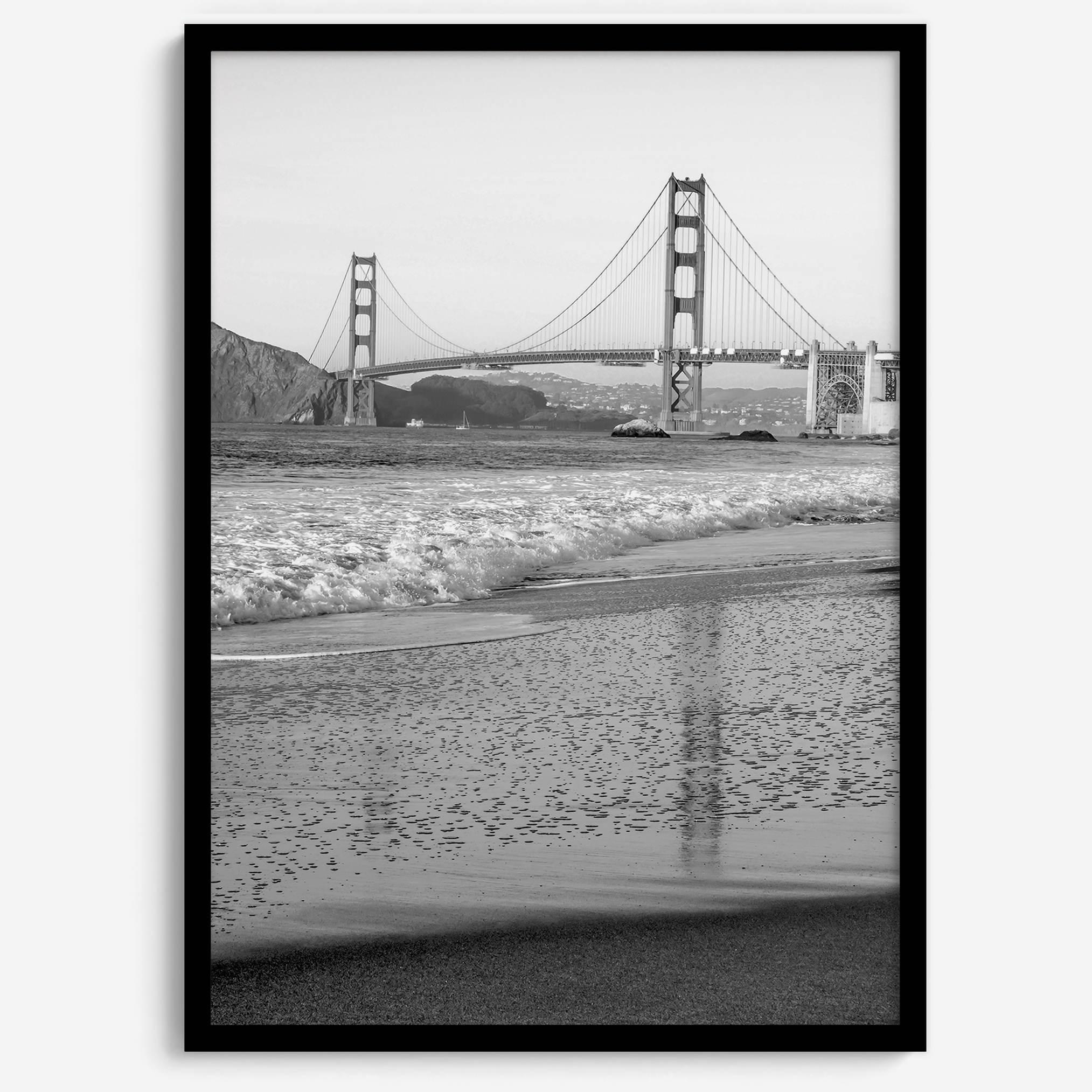A fine art black and white print of the Golden Gate Bridge in San Francisco. This photo was taken from Baker Beach, showing the beautiful reflection of the bridge in the ocean. It is an excellent addition to your wall decor or a San Francisco gift.