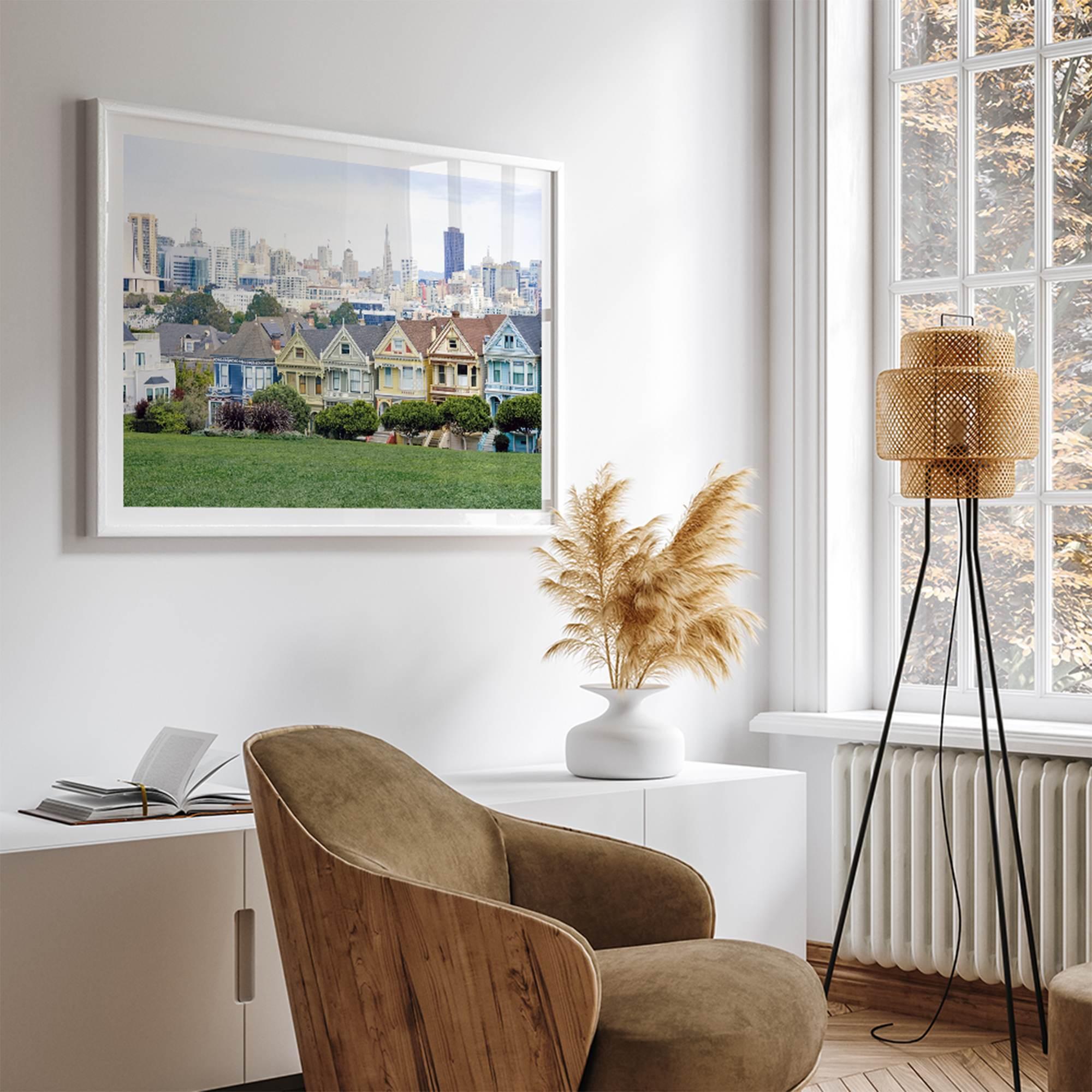 A fine art framed print of the famous colorful painted Ladies Victorian houses in Alamo Square, San Francisco.