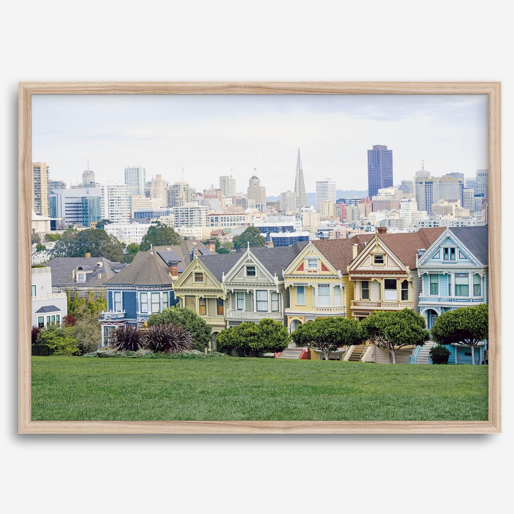 A fine art framed print of the famous colorful painted Ladies Victorian houses in Alamo Square, San Francisco.