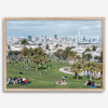 A fine art unframed or framed San Francisco print of Mission Dolores Park showcasing picnic blankets and people enjoying a quiet afternoon with the city skyline in the backdrop.